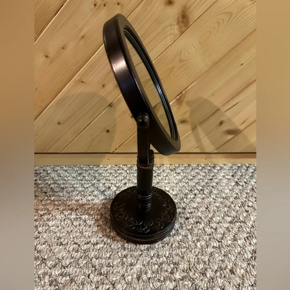 Bathroom countertop double sided magnification mirror.